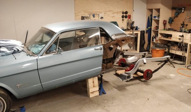 1966 ford mustang coupe in the shop being refurbished